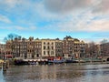 Reflection of Amsterdam famous duch traditional Flemish brick buildings, city canal in Holland, Netherlands Royalty Free Stock Photo